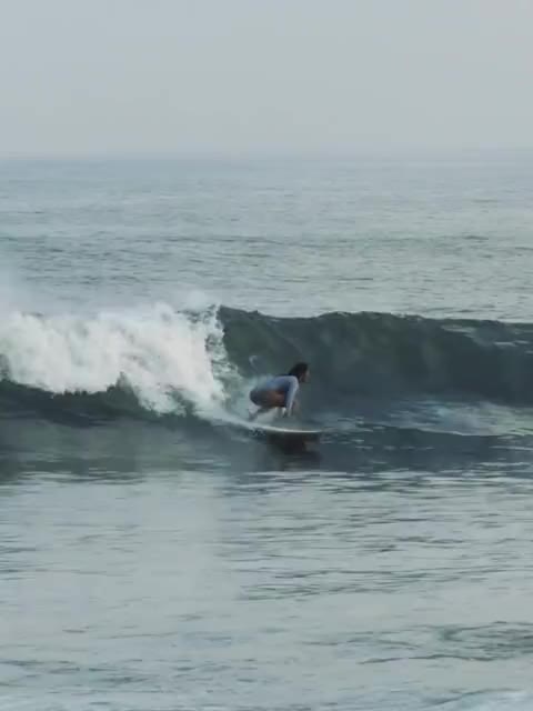 Surfer riding an ocean wave